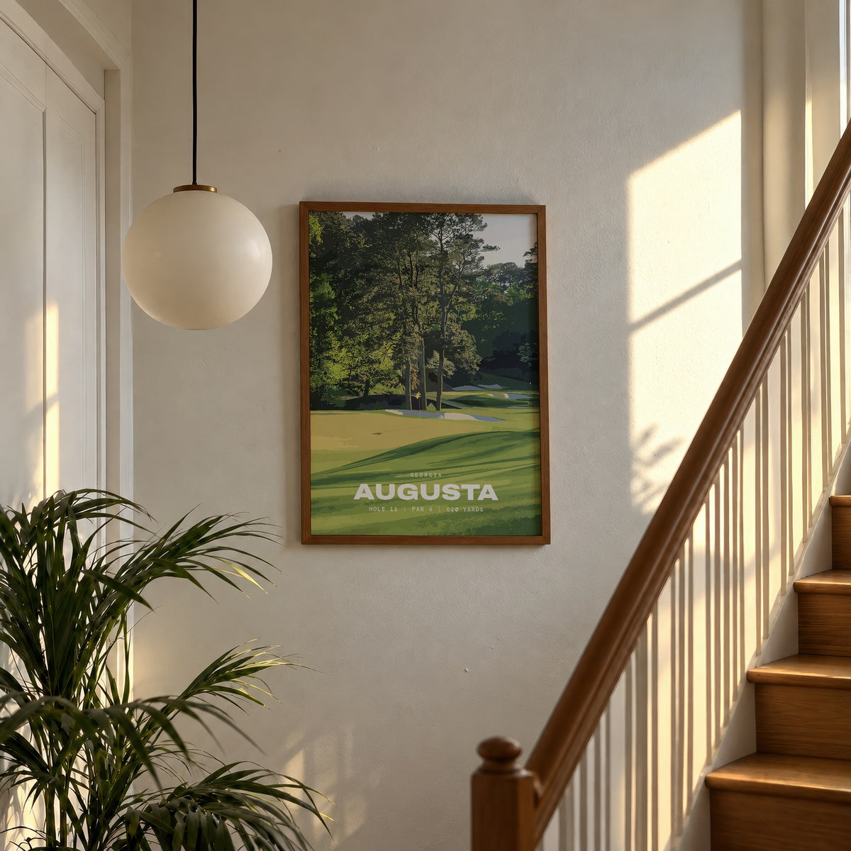Augusta 11th hole golf print of a green below tall Georgia pines, framed above a sunlit staircase