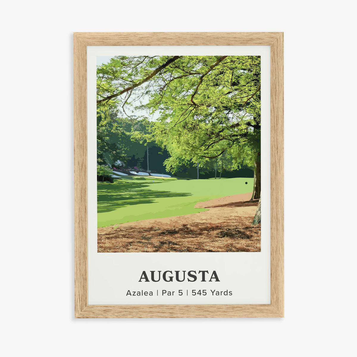 Augusta 13th hole golf print of a par 5 fairway under oak and pines, in a natural wood frame on a plain wall