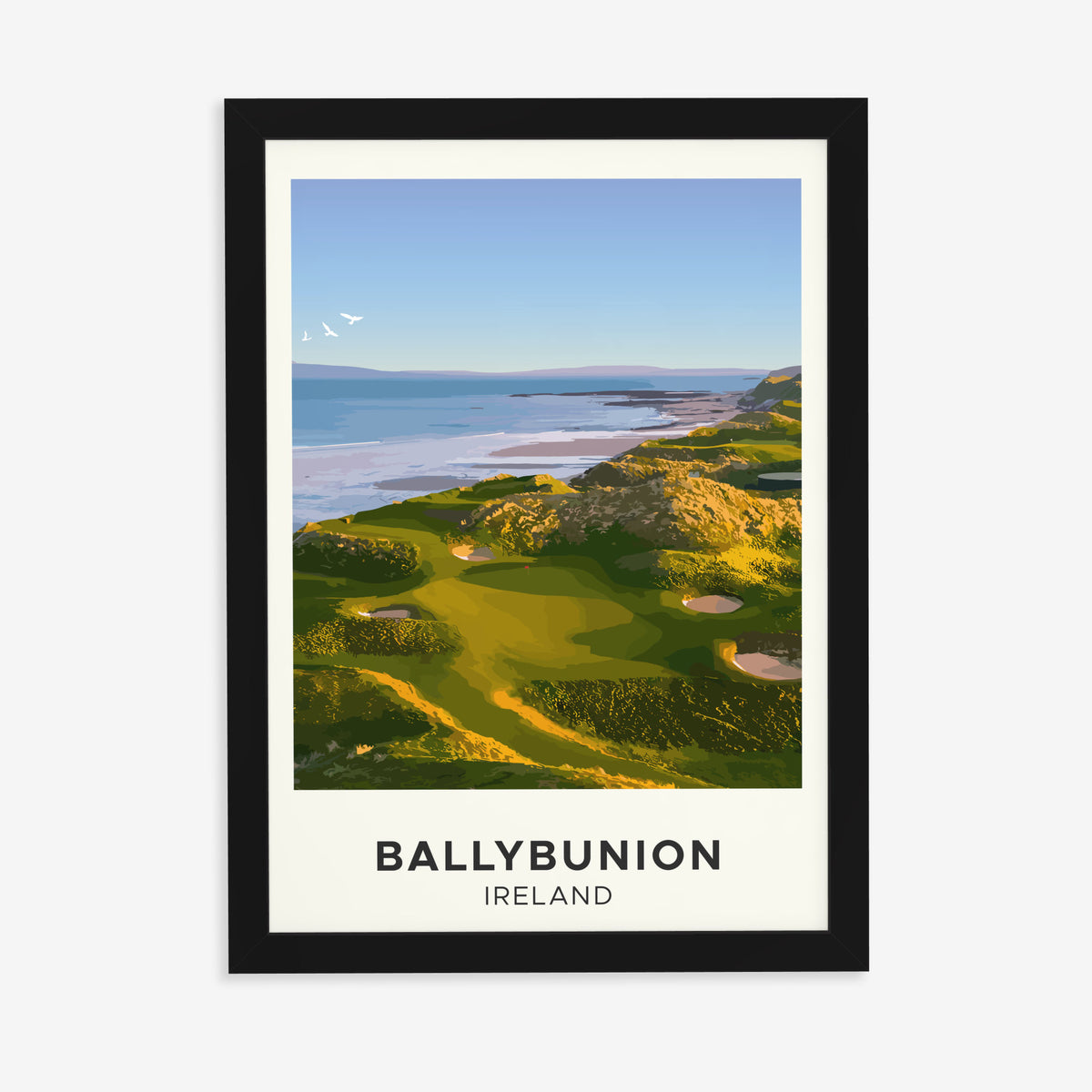 Ballybunion golf print of links greens above the sea, cream border, in a black frame on a plain wall