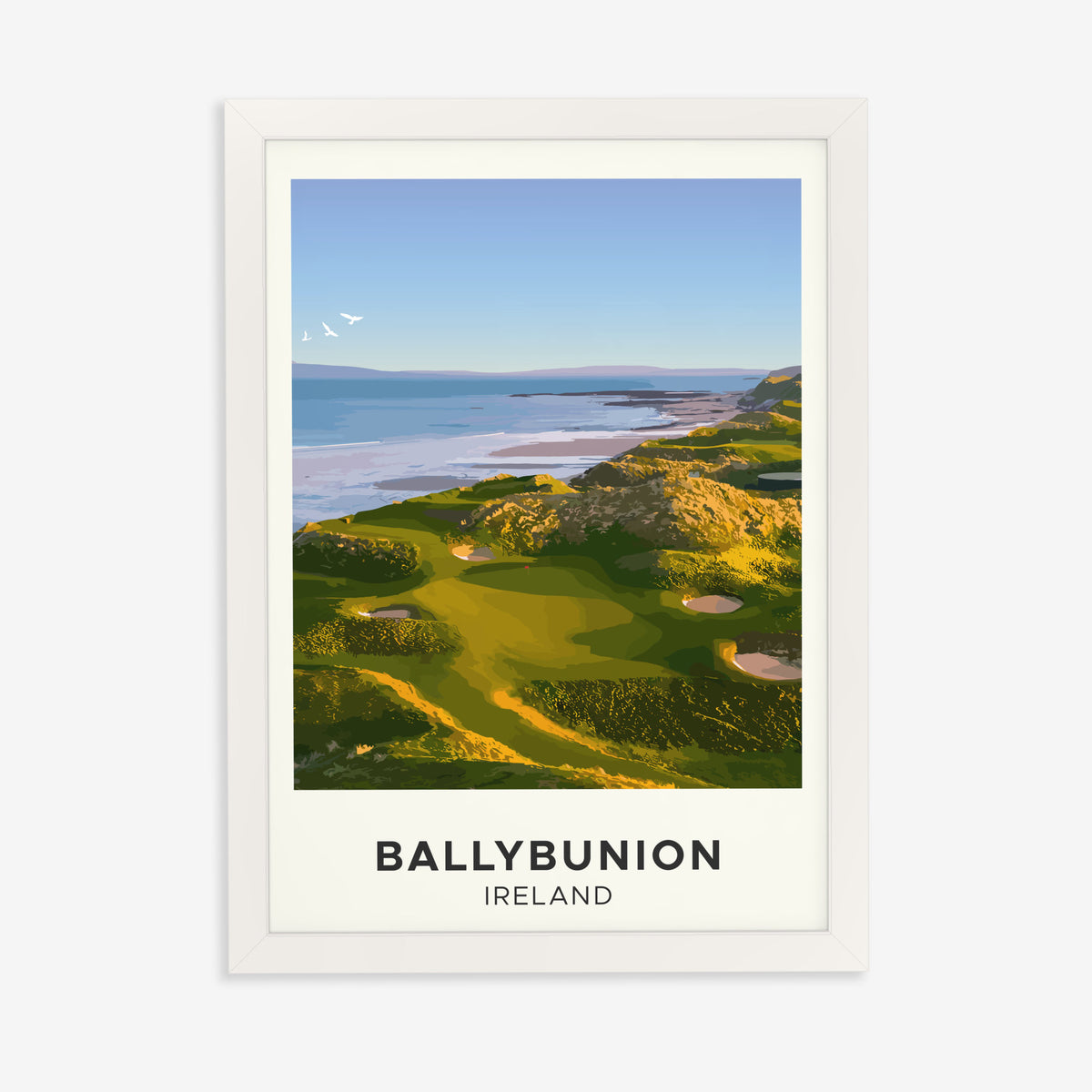 Ballybunion golf print of links greens above the sea, cream border, in a white frame on a plain wall