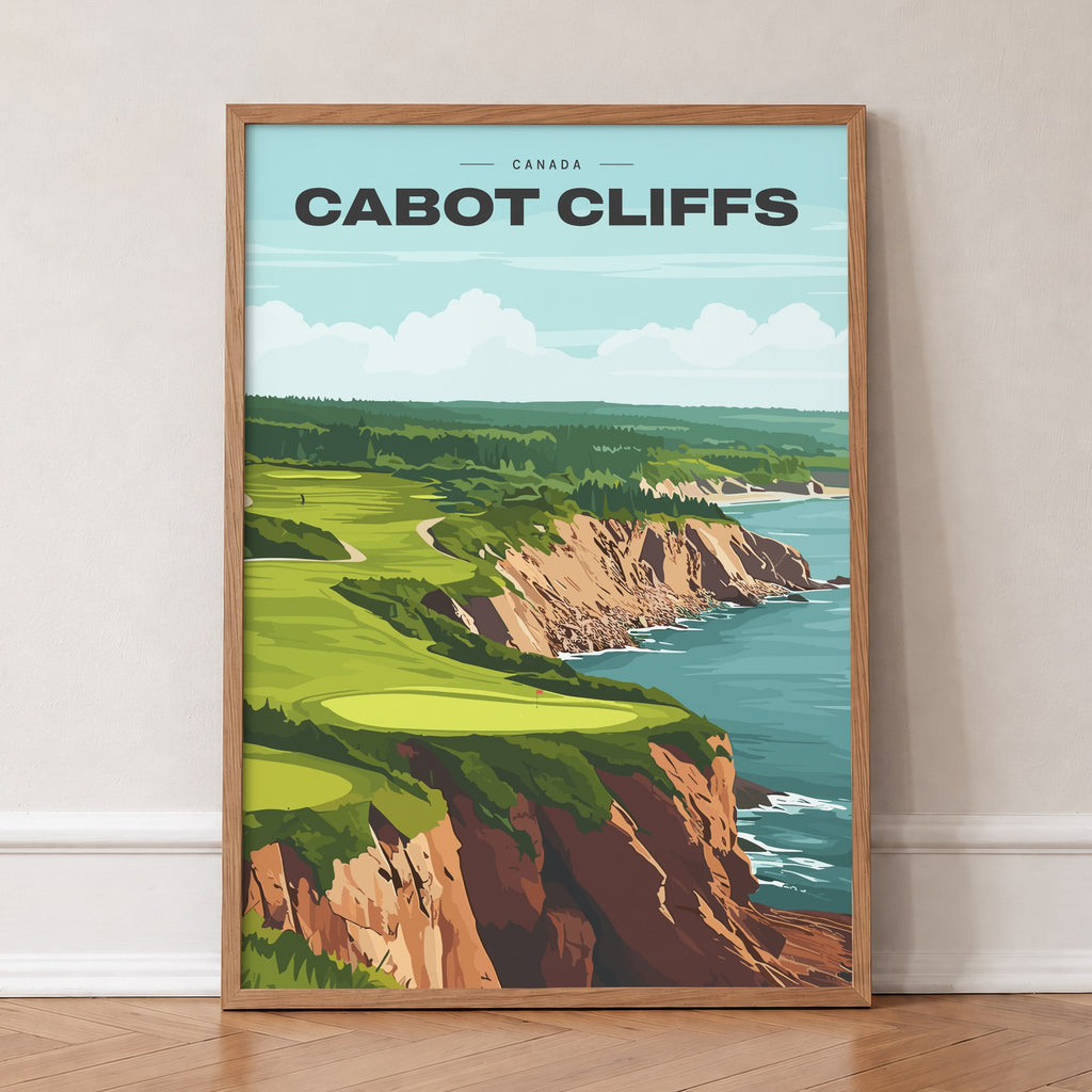 Cabot Cliffs golf print of a green on red clifftops above the sea, in an oak frame, leaning against a wall on a herringbone floor