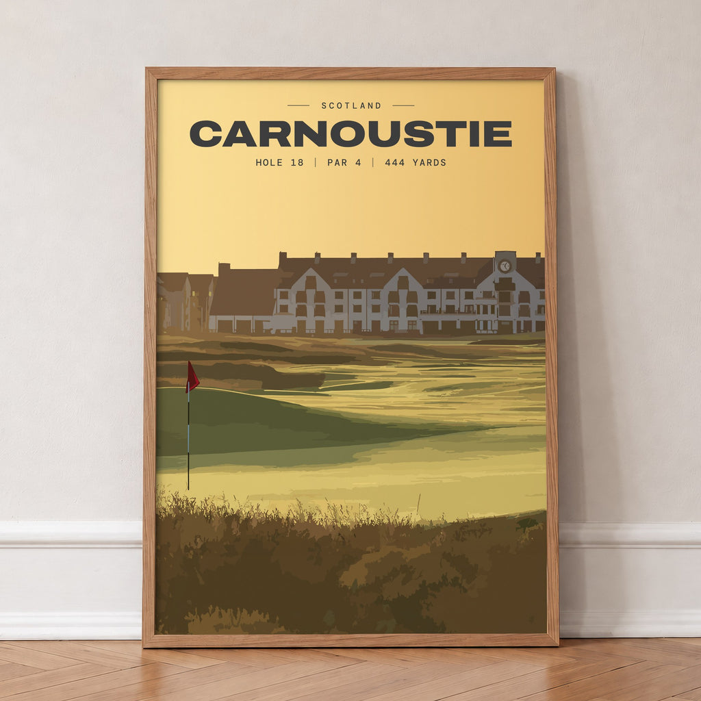 Carnoustie 18th hole golf print of the 18th green at dusk, the hotel behind, in an oak frame, leaning against a wall on a herringbone floor