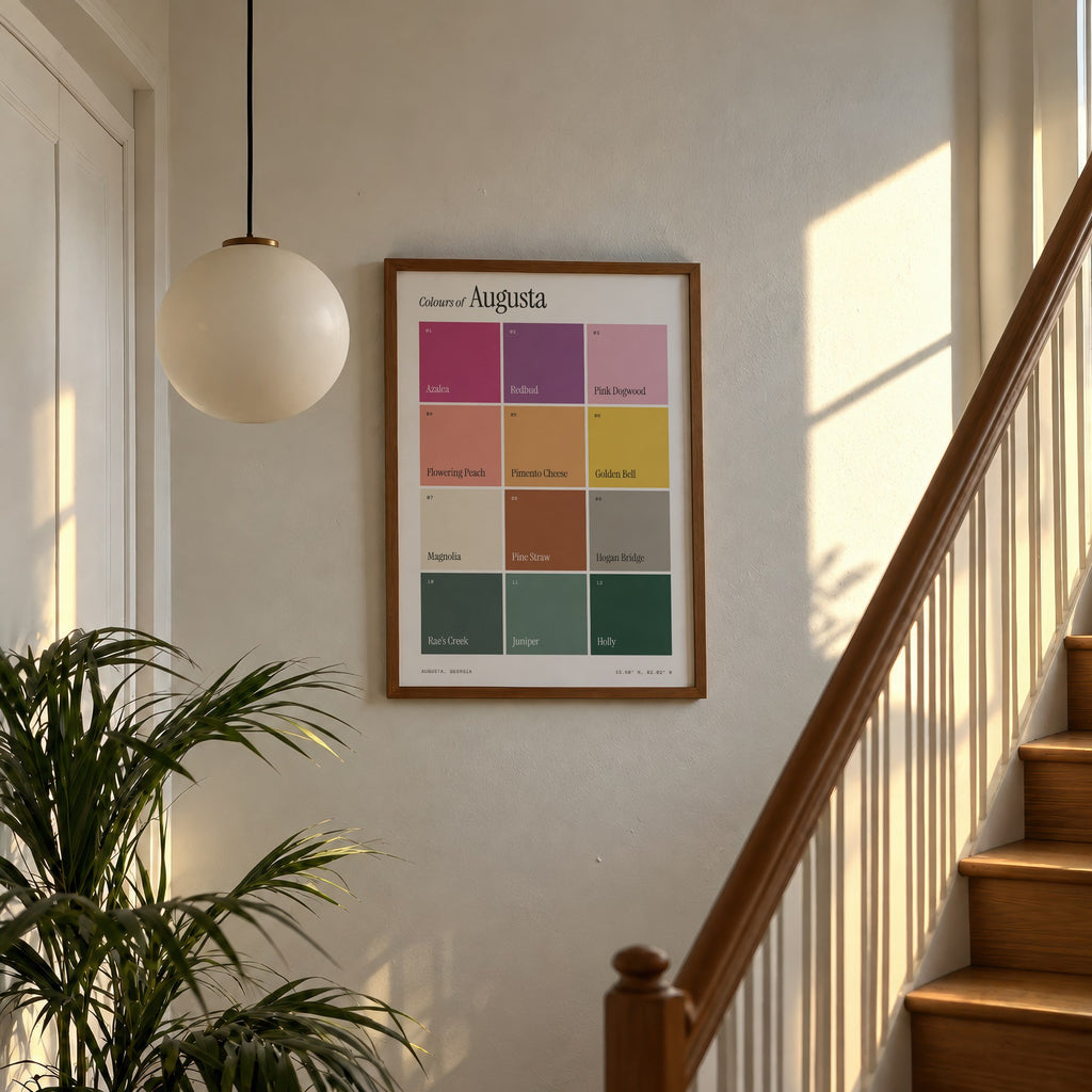 Colours of Augusta print of twelve named colour squares on white, framed above a sunlit staircase