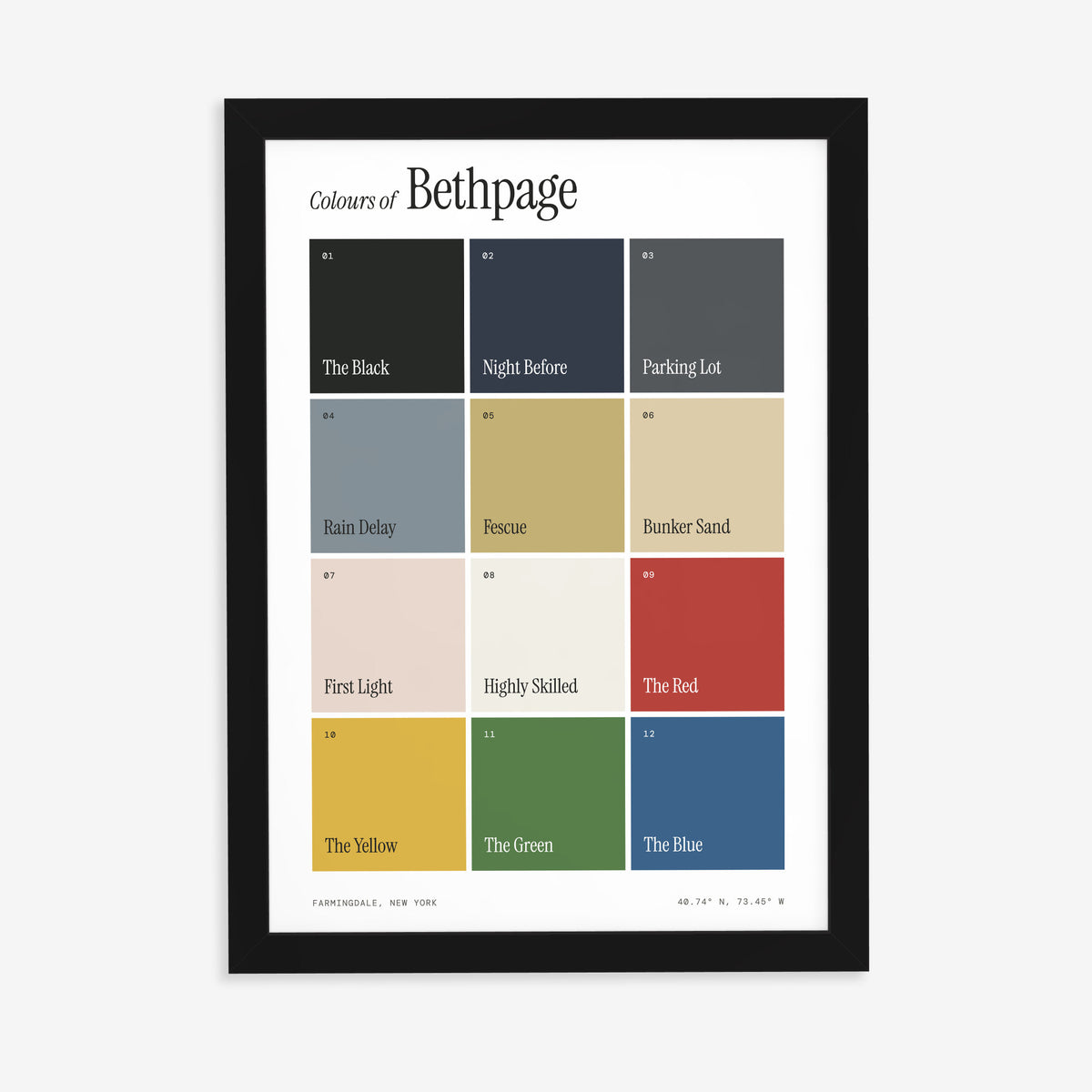 Colours of Bethpage print of twelve named colour squares on white, in a black frame on a plain wall
