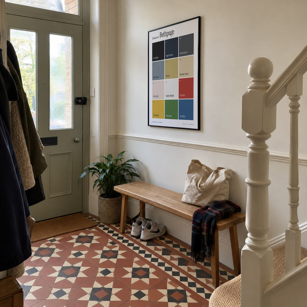 Colours of Bethpage print of twelve named colour squares on white, framed in a hallway with patterned floor tiles