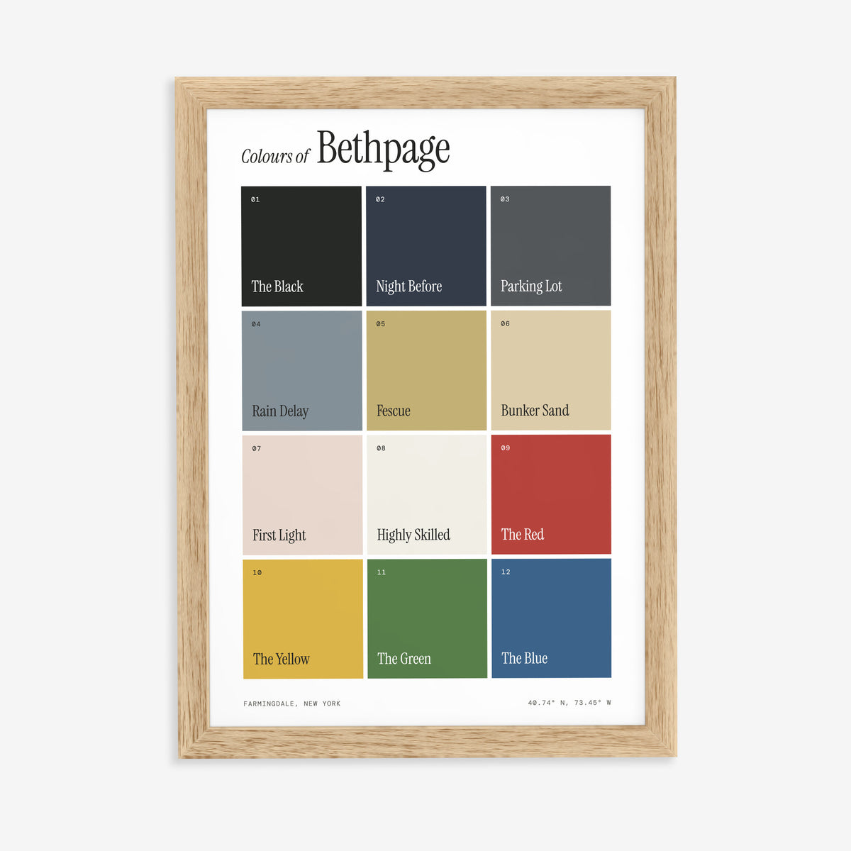 Colours of Bethpage print of twelve named colour squares on white, in a natural wood frame on a plain wall