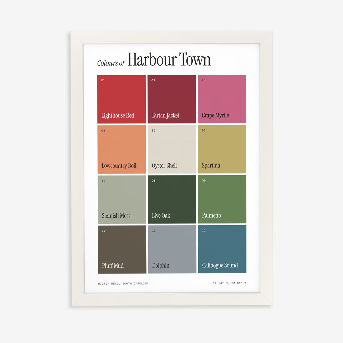 Colours of Harbour Town print of twelve named colour squares on white, in a white frame on a plain wall