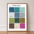 Colours of Pebble Beach print of twelve named colour squares on white, in an oak frame, leaning against a wall on a herringbone floor
