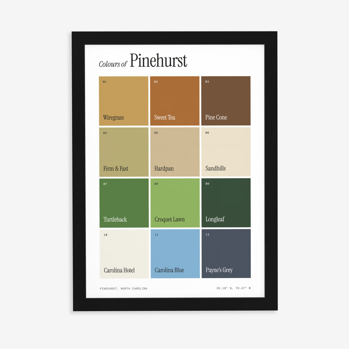 Colours of Pinehurst print of twelve named colour squares on white, in a black frame on a plain wall