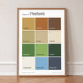 Colours of Pinehurst print of twelve named colour squares on white, in an oak frame, leaning against a wall on a herringbone floor