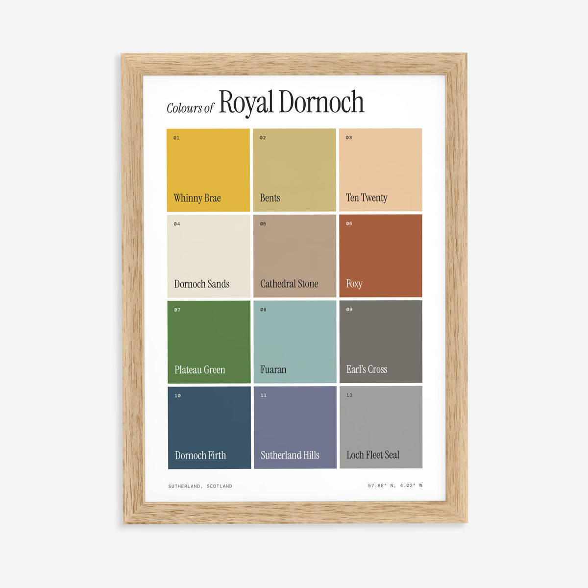 Colours of Royal Dornoch print of twelve named colour squares on white, in a natural wood frame on a plain wall