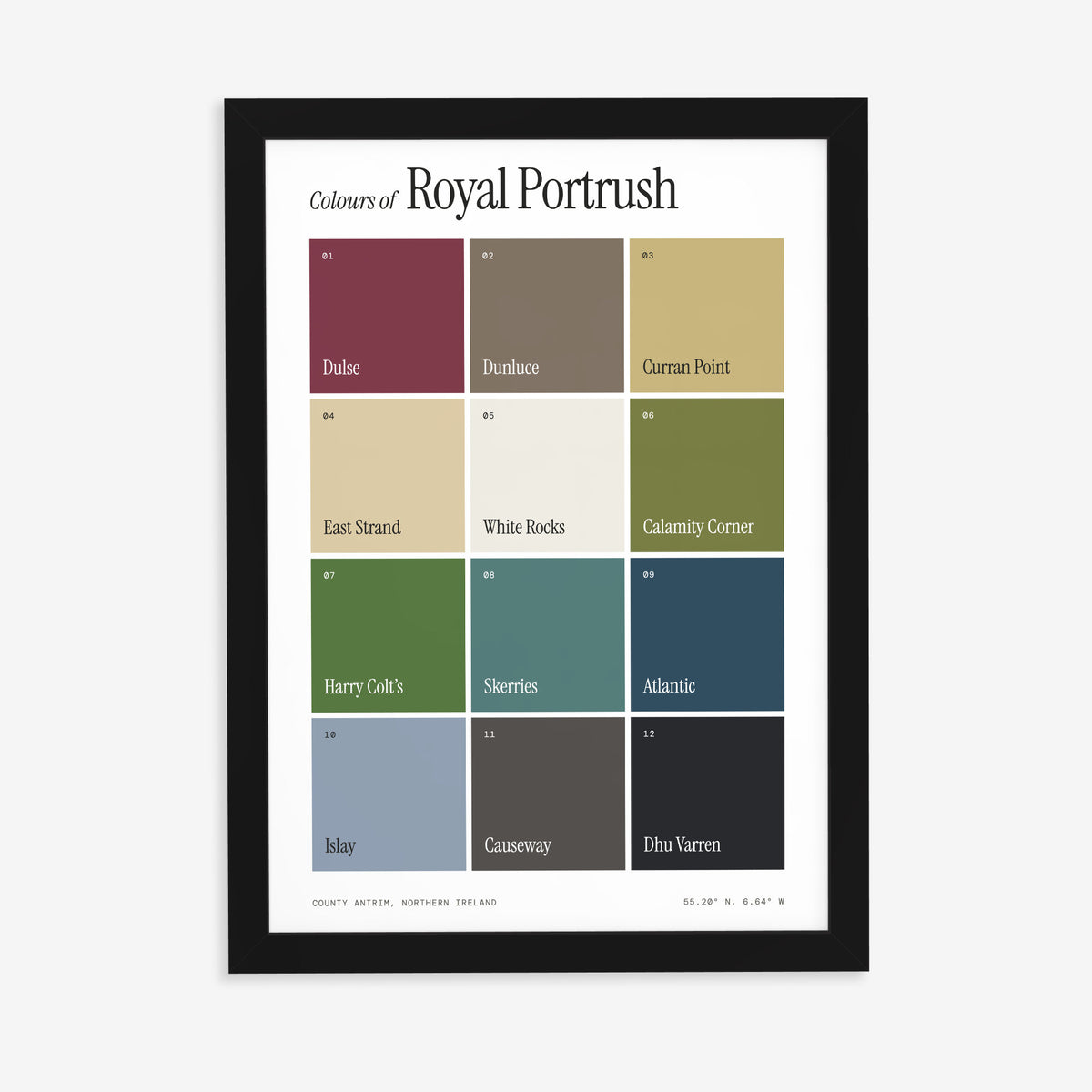 Colours of Royal Portrush print of twelve named colour squares on white, in a black frame on a plain wall