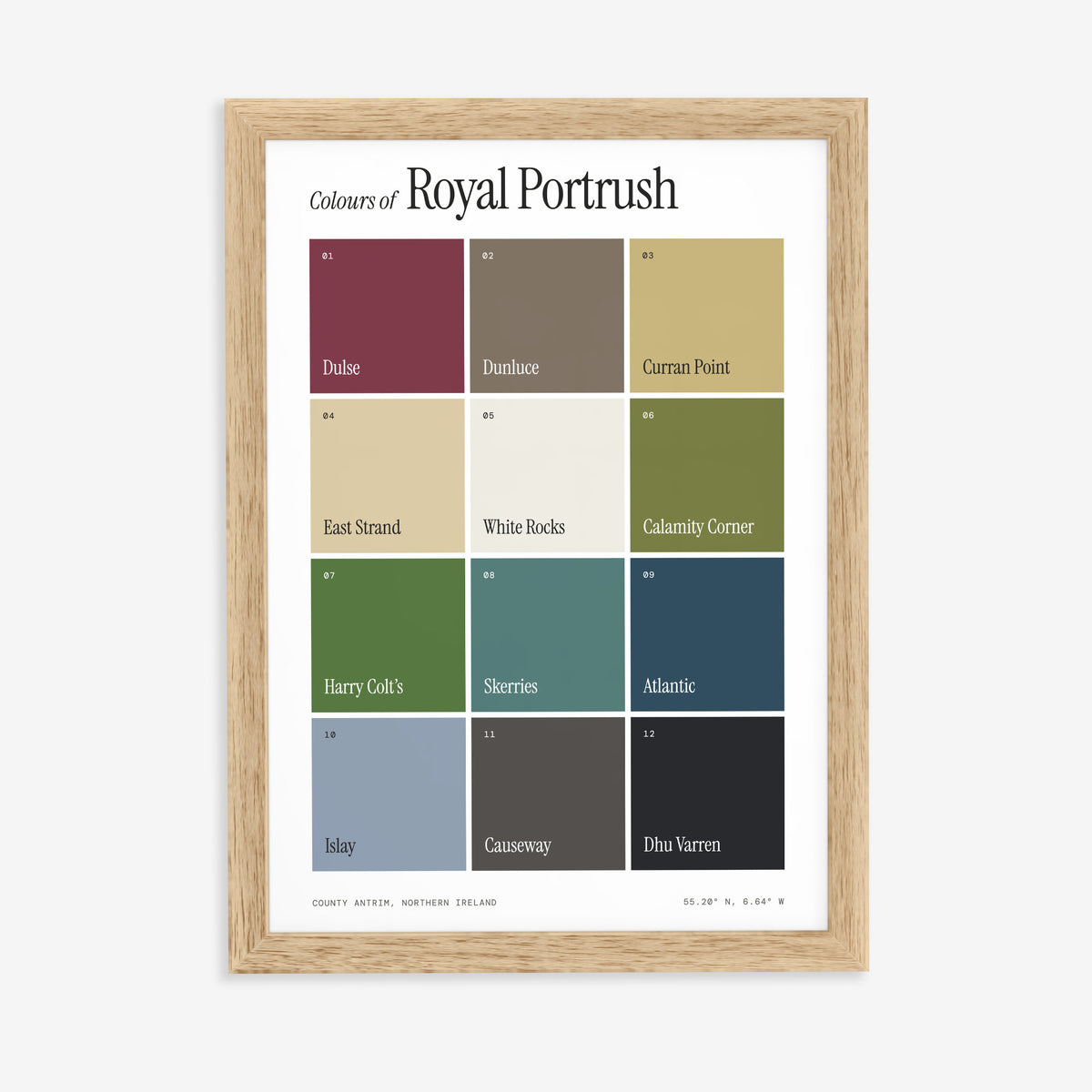 Colours of Royal Portrush print of twelve named colour squares on white, in a natural wood frame on a plain wall