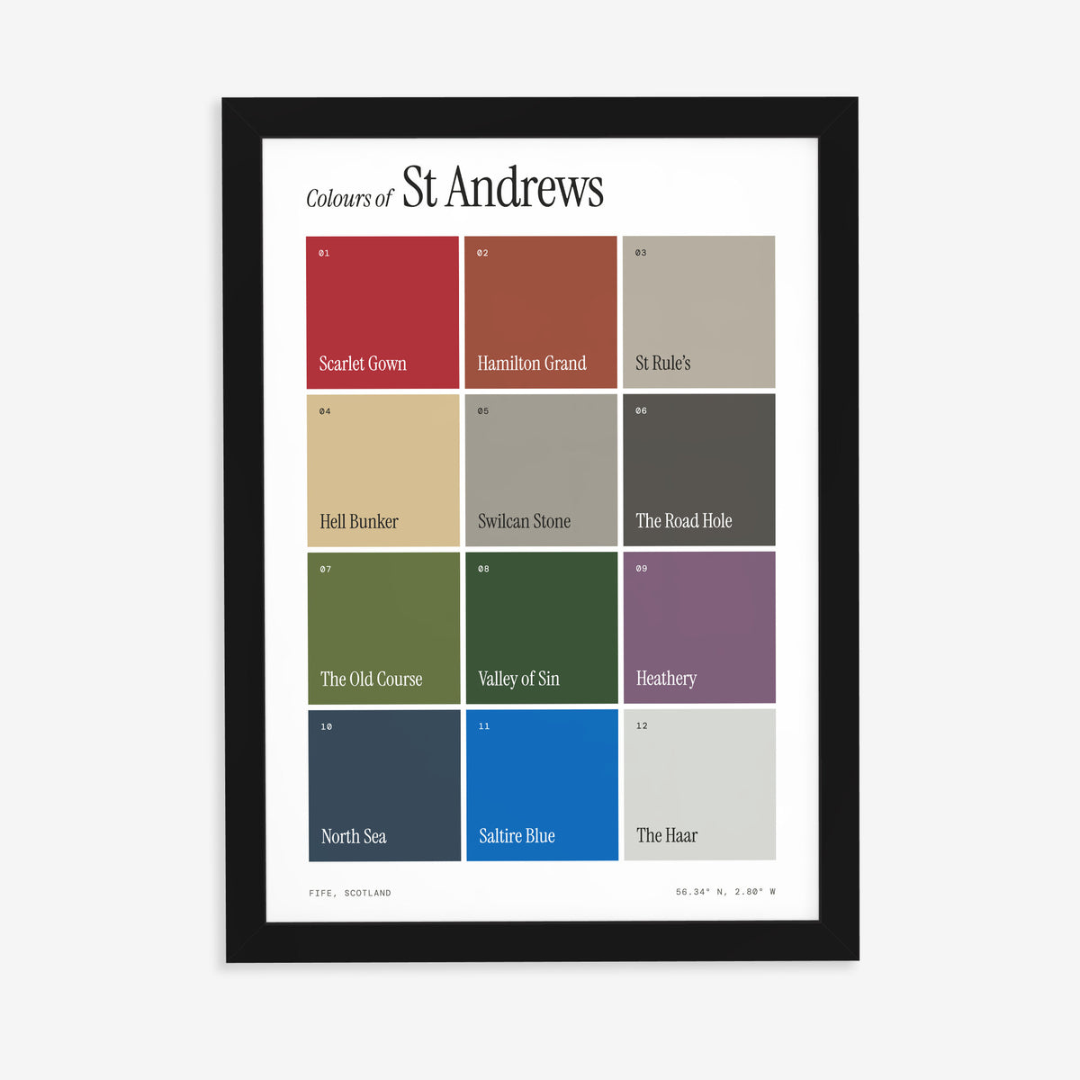Colours of St Andrews print of twelve named colour squares on white, in a black frame on a plain wall