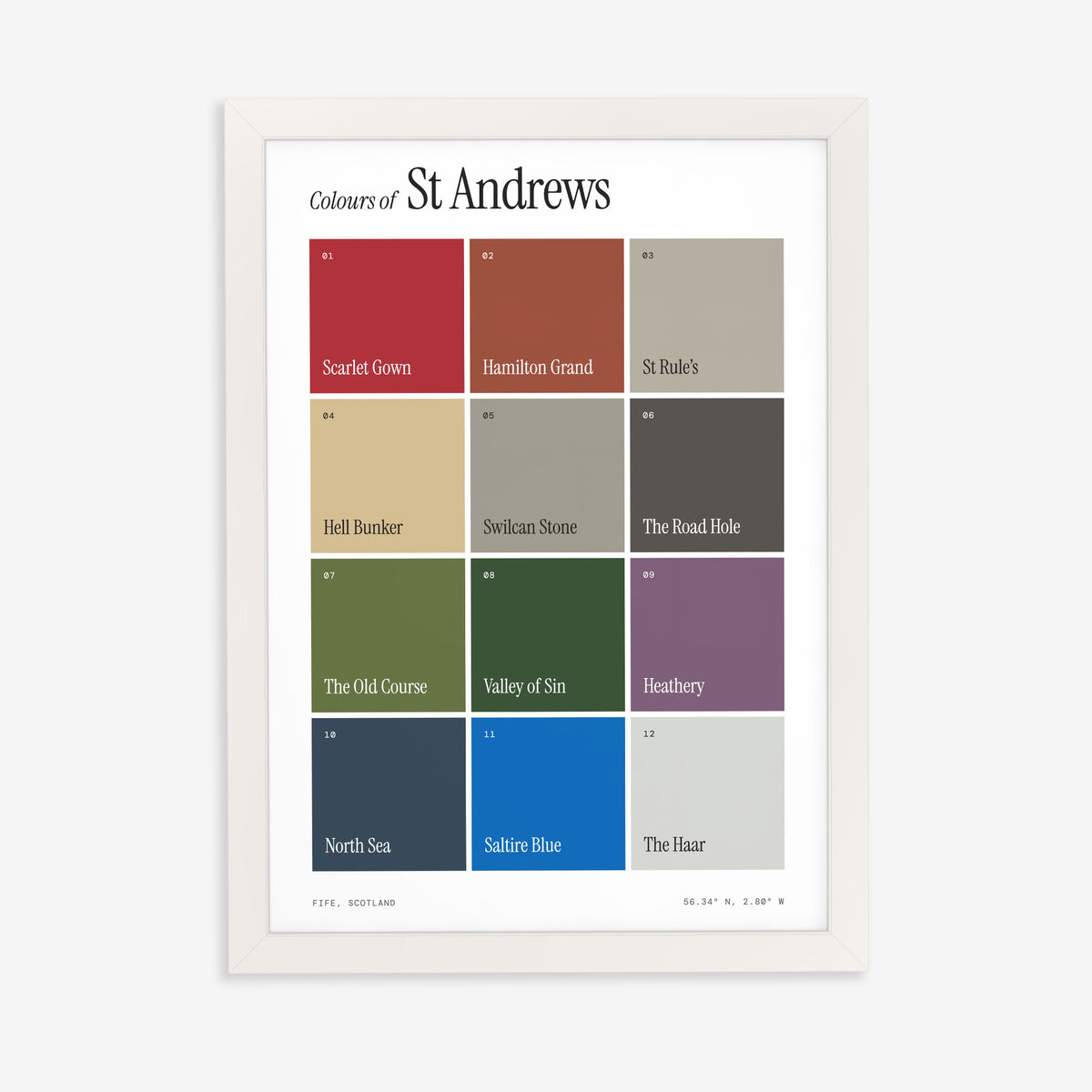 Colours of St Andrews print of twelve named colour squares on white, in a white frame on a plain wall