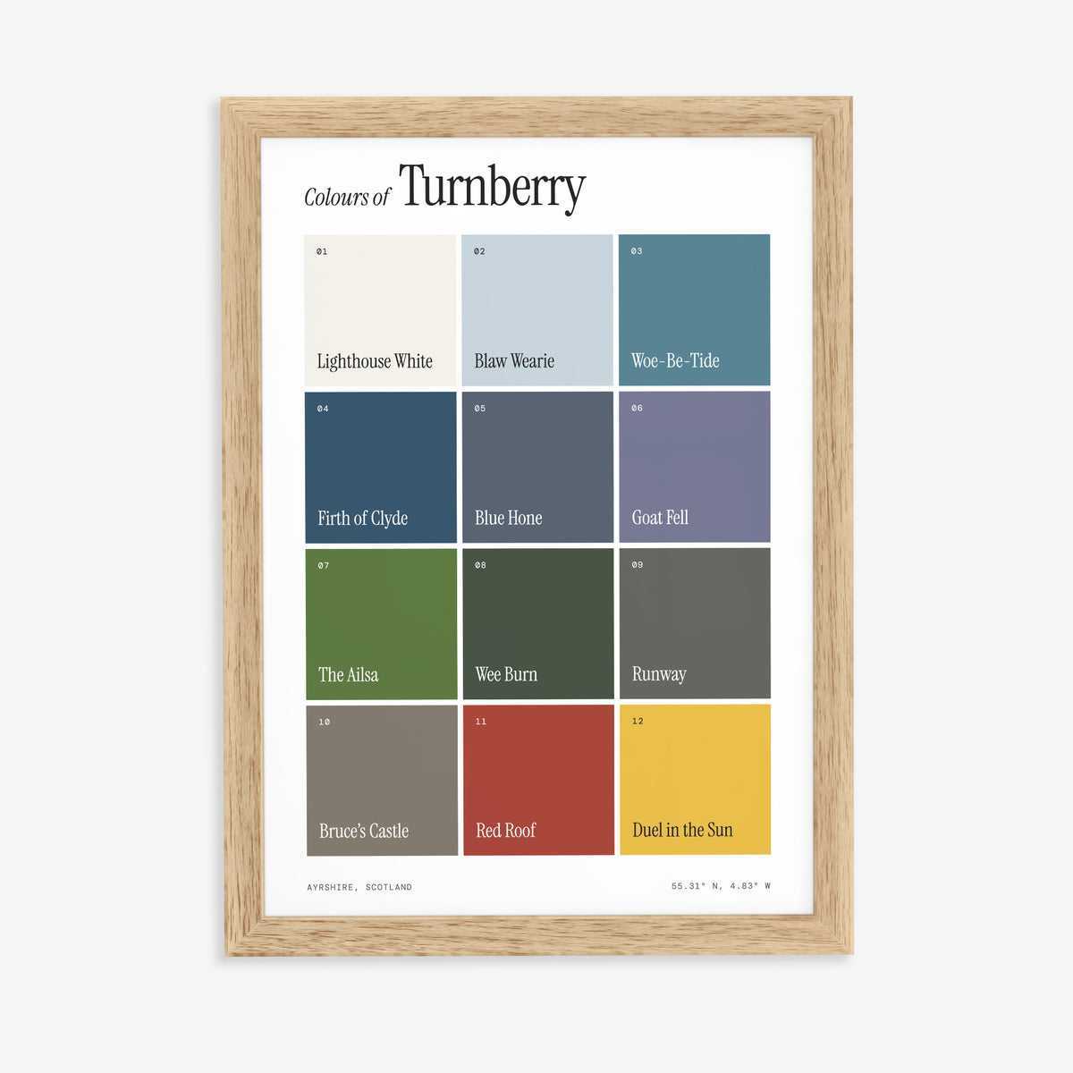 Colours of Turnberry print of twelve named colour squares on white, in a natural wood frame on a plain wall