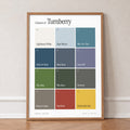 Colours of Turnberry print of twelve named colour squares on white, in an oak frame, leaning against a wall on a herringbone floor