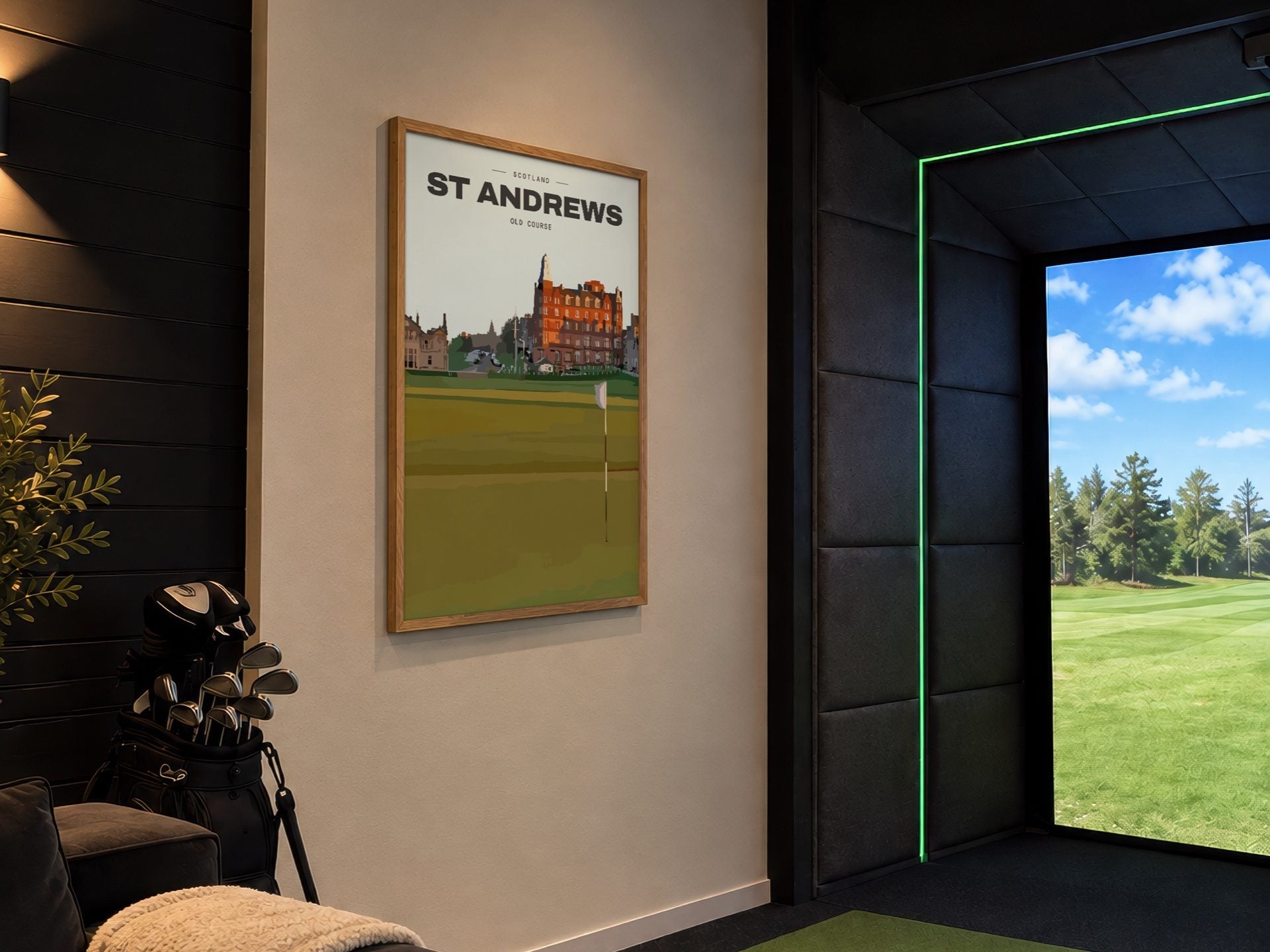 A framed golf course print in an oak frame on the wall of a home golf simulator room