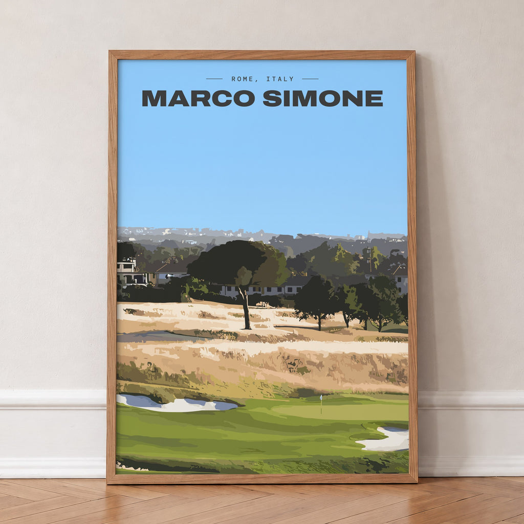 Marco Simone golf print of a green below umbrella pines and gold rough, in an oak frame, leaning against a wall on a herringbone floor