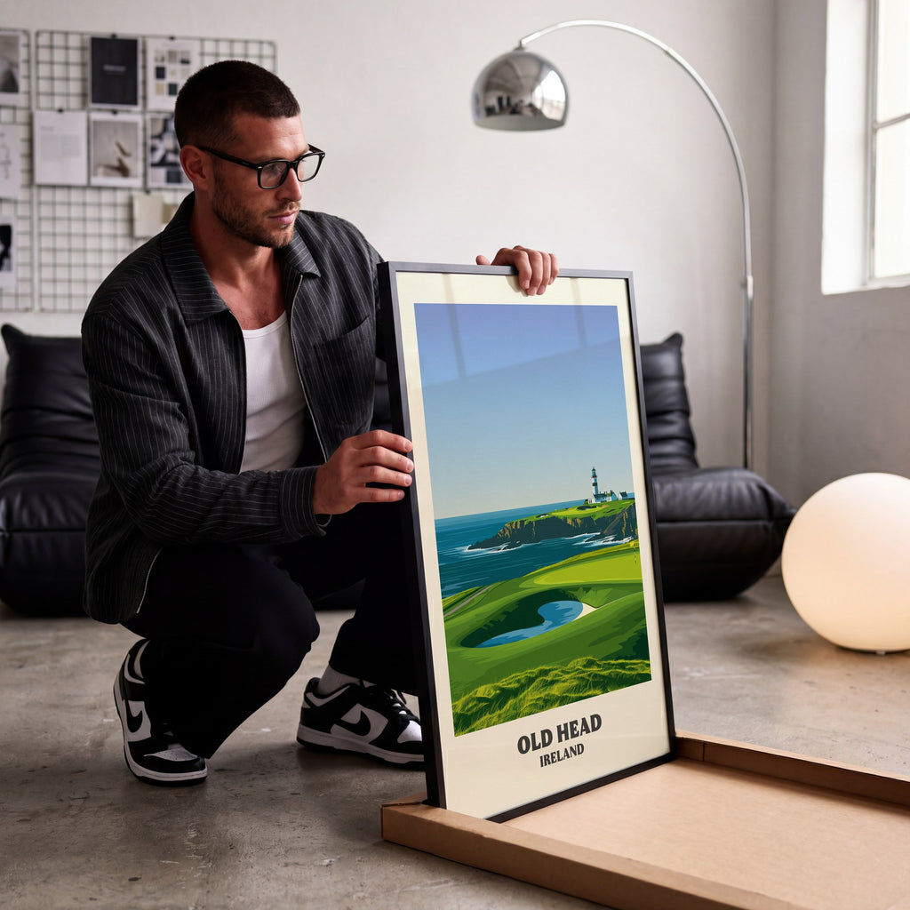 Old Head golf print of a lighthouse on a headland above a green, being unboxed in a bright studio