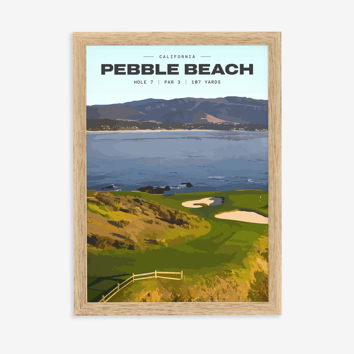 Pebble Beach 7th hole golf print of a small green on a point above the bay, in a natural wood frame on a plain wall
