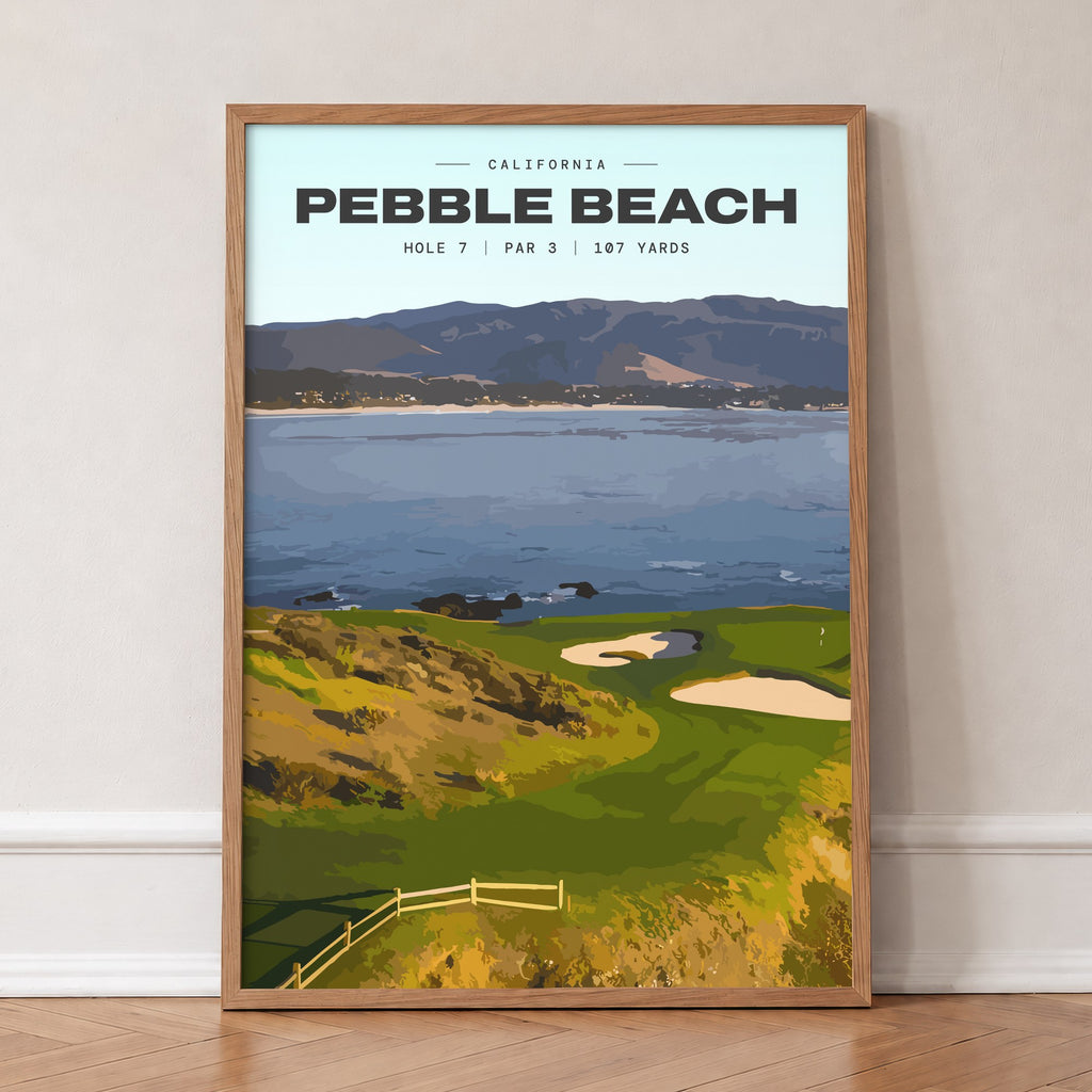 Pebble Beach 7th hole golf print of a small green on a point above the bay, in an oak frame, leaning against a wall on a herringbone floor