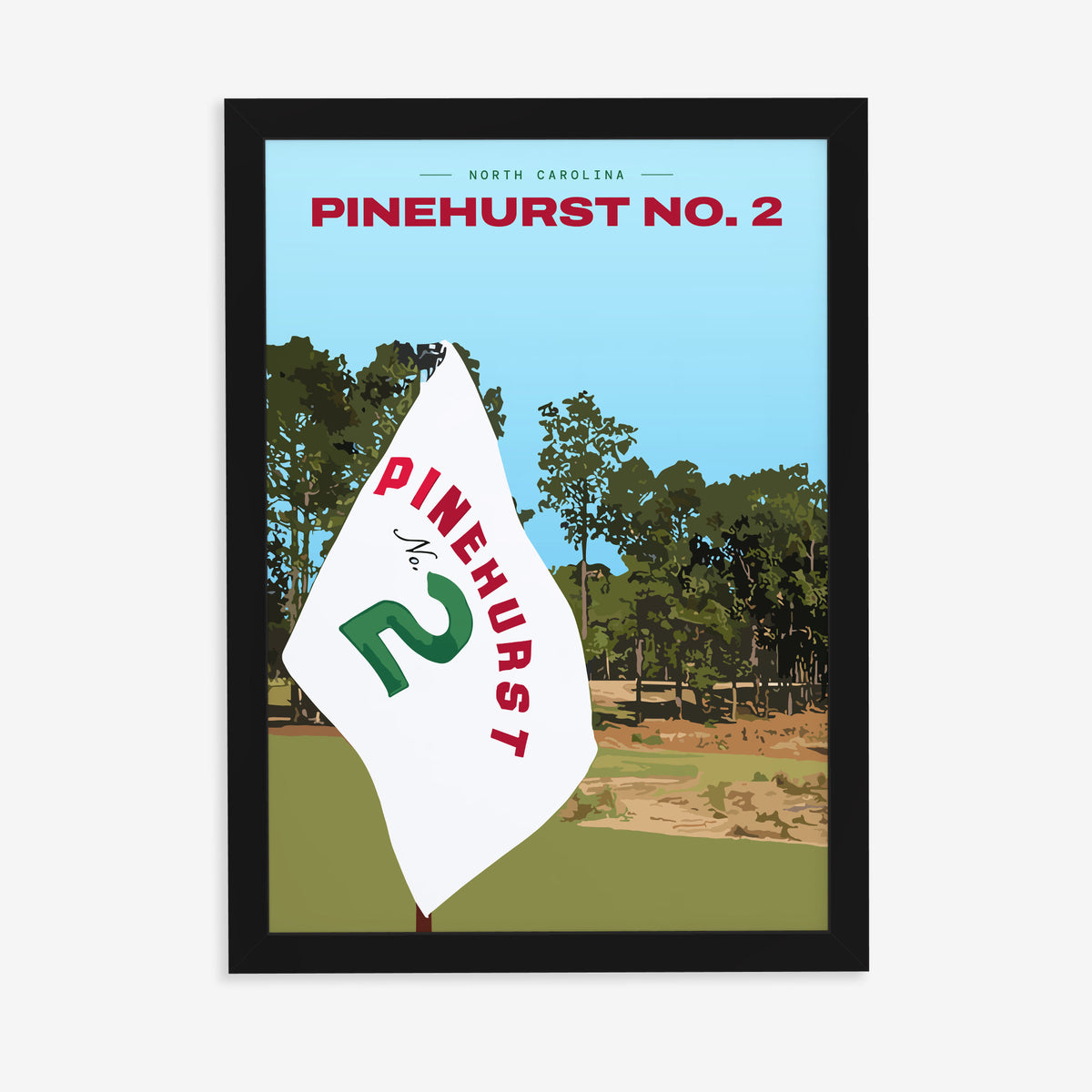 Pinehurst No. 2 golf print of a white pin flag before sandy waste and pines, in a black frame on a plain wall
