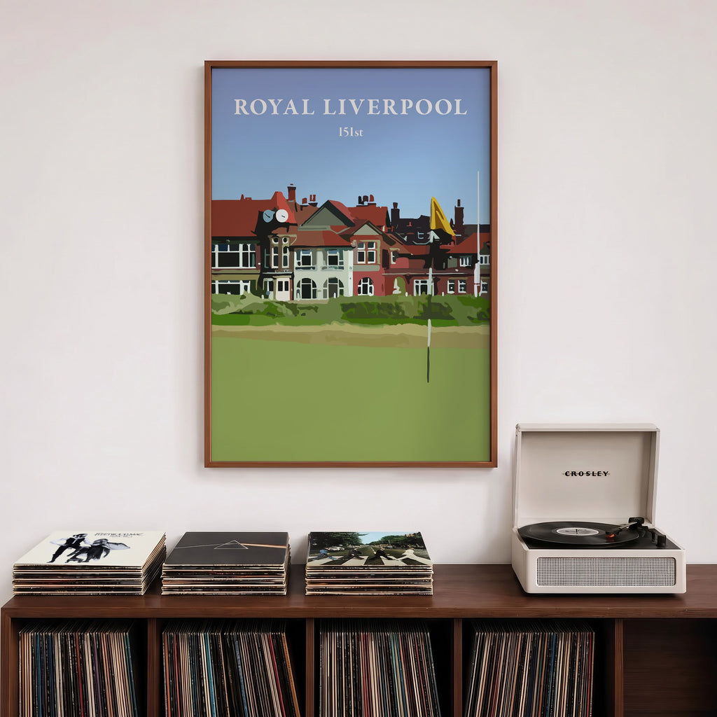 Royal Liverpool 2023 golf print of the clubhouse behind a yellow flag, framed above a record shelf beside a turntable