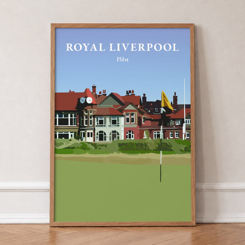 Royal Liverpool 2023 golf print of the clubhouse behind a yellow flag, in an oak frame, leaning against a wall on a herringbone floor