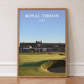 Royal Troon 2024 golf print of the clubhouse behind the 18th green, in an oak frame, leaning against a wall on a herringbone floor