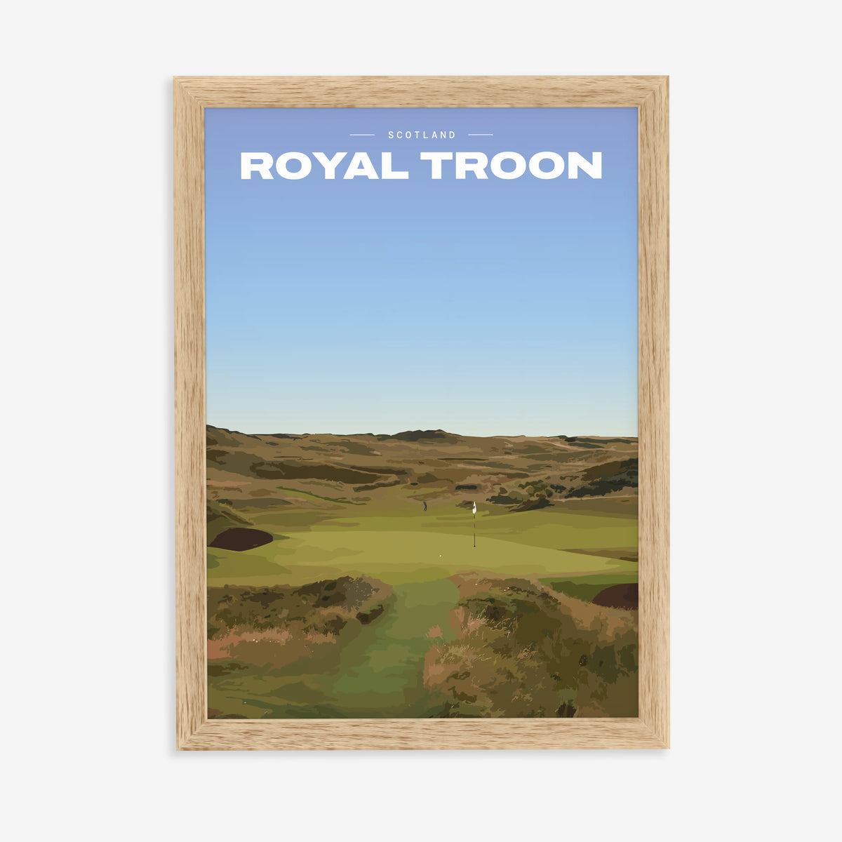 Royal Troon golf print of a links fairway through dunes to a flag, in a natural wood frame on a plain wall