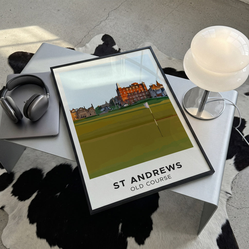 St Andrews Old Course golf print of the 18th green below Hamilton Grand, framed, lying on a steel table on a cowhide rug