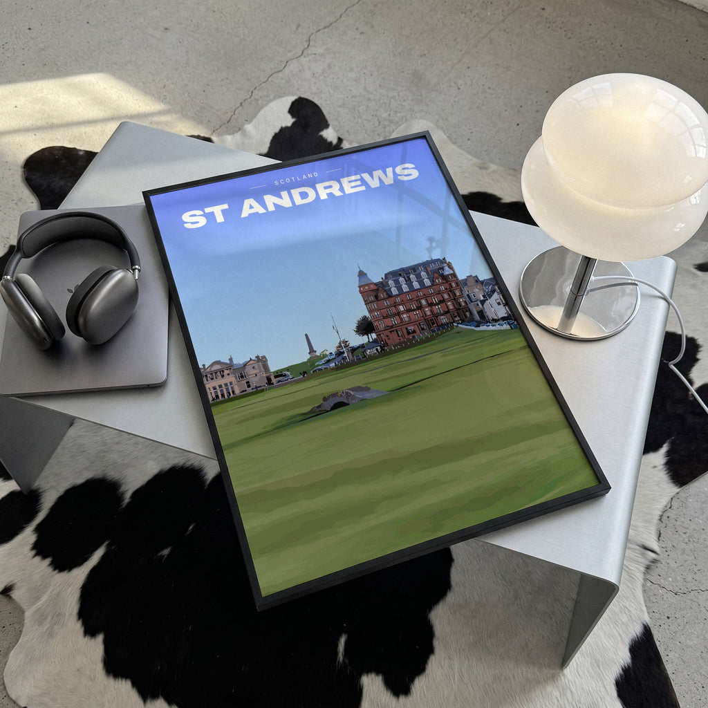 St Andrews Swilcan Bridge golf print of the Swilcan Bridge below the town, framed, lying on a steel table on a cowhide rug