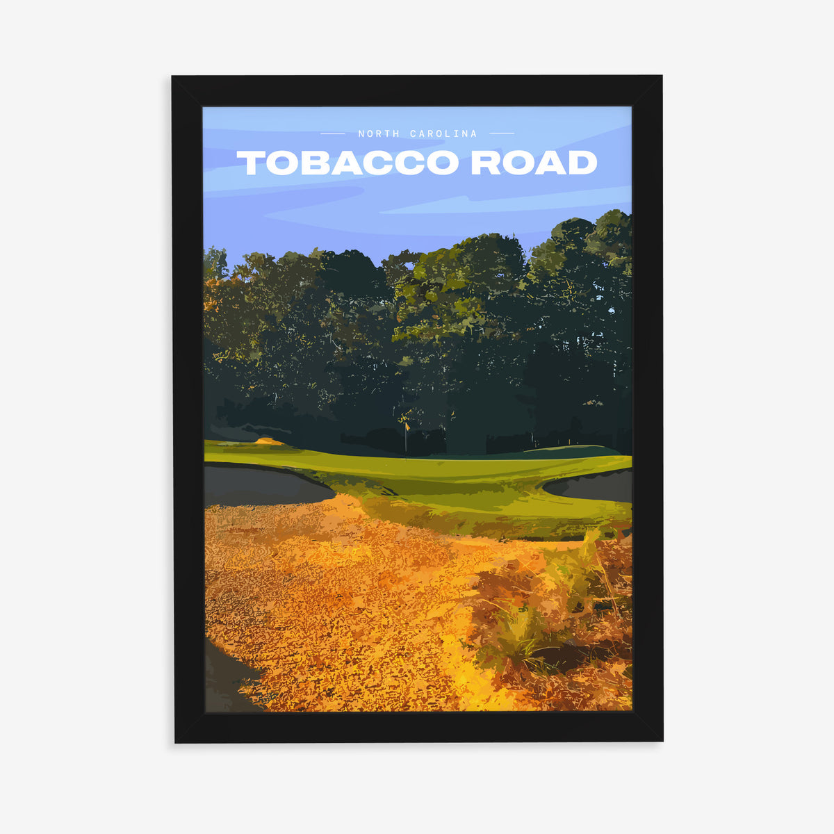 Tobacco Road golf print of a green behind golden sand and pines, in a black frame on a plain wall