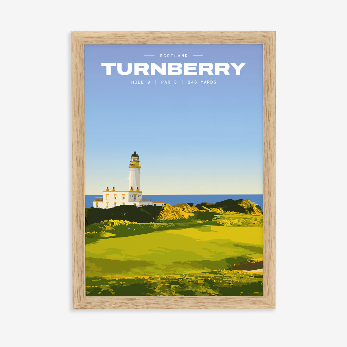 Turnberry 9th hole golf print of a white lighthouse above a links green, in a natural wood frame on a plain wall